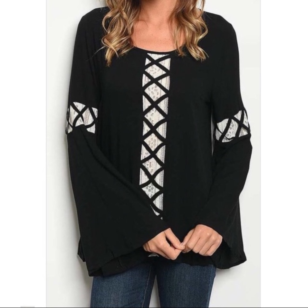 Adorable black top with lace accents.